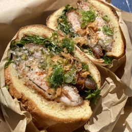 Cambodian fried sando Two battered thigh chicken, pickled cabbage, black garlic aioli, on brioche. Moist, delicious, flavorful, not spicy. Cambodian fried sando Two battered thigh chicken, pickled cabbage, black garlic aioli, on brioche. Moist, delicious, flavorful, not spicy.