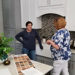 Cape Fear Flooring & Restoration - Owner Amie helps a customer match tile to her cabinets.
