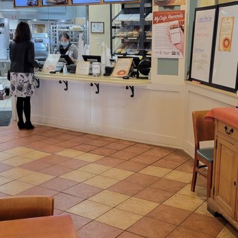 Cafe Carolina and Bakery - a woman standing at the counter - Bakeries Near Me - Raleigh, North Carolina Cafe Carolina and Bakery - a woman standing at the counter - Bakeries Near Me - Raleigh, North Carolina
