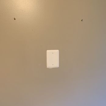 Crisp Line Painting - After: no more holes in the wall! (this area is covered by a mirror, so we didn't need more intensive repair here) - Painters Near Me
