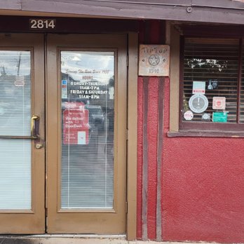 Tip Top Cafe - Front door with their hours. - American Near Me - San Antonio, Texas
