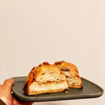 La Farine - a person holding a plate with a pastry on it - Bakeries Near Me - Oakland, California La Farine - a person holding a plate with a pastry on it - Bakeries Near Me - Oakland, California