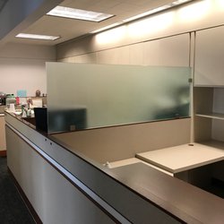 J & C Glass Works - Office partition made of tempered acid etch glass mounted with standard clamps