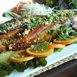 Sáu Can Tho Vietnamese Kitchen - Baked Fish served with fresh herbs, cucumber, pickled carrots and radish, vermicelli, wrapped in rice paper, and dipped in tamarind sauce.