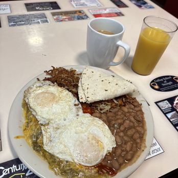 Route 66 Railway Cafe - 2 cheese enchiladas with red and green chili (Christmas) 2 over easy eggs, beans, hash browns, & a tortilla - American Near Me - Gallup, New Mexico Route 66 Railway Cafe - 2 cheese enchiladas with red and green chili (Christmas) 2 over easy eggs, beans, hash browns, & a tortilla - American Near Me - Gallup, New Mexico