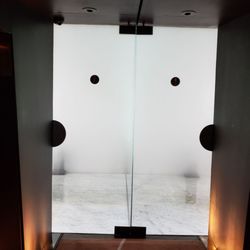 Felix - Glass-door washrooms, ladies on the left.