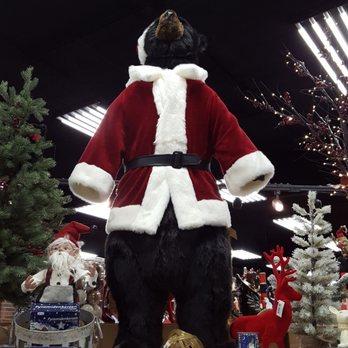 Slovacek's West - Holiday shopping. A black bear modeling a Santa coat! - Bakeries Near Me - West, Texas