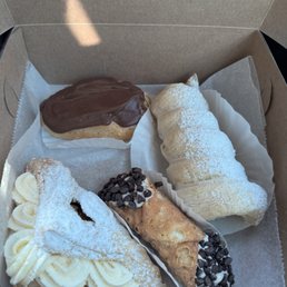 Rum cream horn, eclair, apple pastry Rum cream horn, eclair, apple pastry