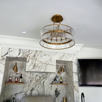 JMT Lighting and Electrical - Installed this chandelier and sconces for open shelves. We also wired and hung the flat screen TV and provided outlets for convenience - Electricians Near Me - Costa Mesa, California JMT Lighting and Electrical - Installed this chandelier and sconces for open shelves. We also wired and hung the flat screen TV and provided outlets for convenience - Electricians Near Me - Costa Mesa, California