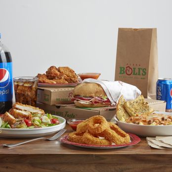 Pizza Boli's - a variety of food on a table - Pizza Near Me - Westminster, Maryland