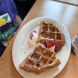Maple Street Biscuit - Quarry Village - Little Grace: half of a chocolate chip waffle, strawberries, powdered sugar and whipped cream with syrup. Comes with milk OR apple juice