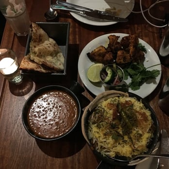 Dishoom - Clockwise from top left: Cheese naan, chicken tikka, lamb briyani, and black daal (hopefully I remembered correctly!) 5/5 - Indian Near Me - London, XGL