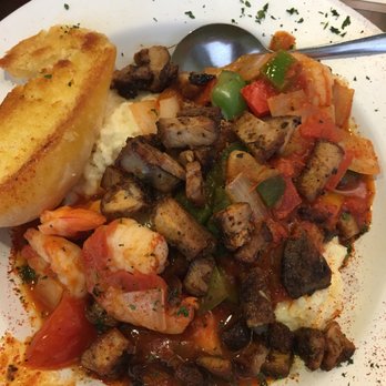 Acadian Grille Scratch Kitchen - Shrimp and Grits. The tasso was fantastic and worked so well with the dish. Wish the veggie were a bit more char but that's a personal prefe - Cajun/Creole Near Me - Omaha, Nebraska