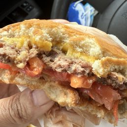 Cheese burger that is undercooked Cheese burger that is undercooked
