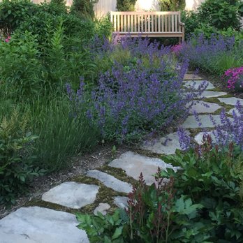 Creative Design Landscapes - a bench in a garden - Landscaping Near Me - East Hampton, New York
