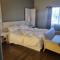 Rooms were clean and bright. Sorry for unmade bed Rooms were clean and bright. Sorry for unmade bed