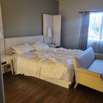 Aspire Inn and Suites - Rooms were clean and bright. Sorry for unmade bed - Hotels Near Me - Orange, California Aspire Inn and Suites - Rooms were clean and bright. Sorry for unmade bed - Hotels Near Me - Orange, California