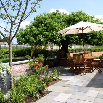 Lifestyle Landscapes - Bluestone patio, brick seatwall with bluestone cap - Landscaping Near Me - Seattle, Washington Lifestyle Landscapes - Bluestone patio, brick seatwall with bluestone cap - Landscaping Near Me - Seattle, Washington