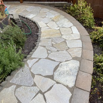 Golden Eagle Hardscapes - a stone walkway in a backyard - Landscaping Near Me Golden Eagle Hardscapes - a stone walkway in a backyard - Landscaping Near Me