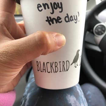 Blackbird Coffee - a hand holding a coffee cup - Coffee & Tea Near Me - Blaine, Washington Blackbird Coffee - a hand holding a coffee cup - Coffee & Tea Near Me - Blaine, Washington