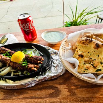 Karahi King - The ultimate trio: kebabs, naan, and Coke! - Pakistani Near Me - Bronx, New York