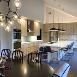 Jr's Quality Tile & Hardwood - Modern kitchen with quartz counter tops, Maple cabinets, tile floor. tile back splash, undercabinet lighting, recessed lighting.