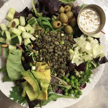 Cafe Santosha - Mean greens salad out of this world! Lentils, peas, avocado, cucumber,olives, pumpkin seeds,sesame ginger dressing etc.. - New American Near Me - Trexlertown, Pennsylvania