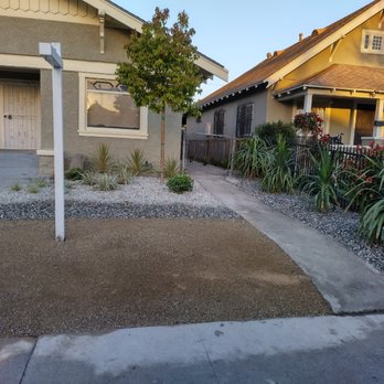 Cris Arroyo - a front yard of a house - Landscaping Near Me Cris Arroyo - a front yard of a house - Landscaping Near Me