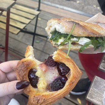La Bicyclette Bakery - a person holding a croissant sandwich - Bakeries Near Me - Brooklyn, New York La Bicyclette Bakery - a person holding a croissant sandwich - Bakeries Near Me - Brooklyn, New York