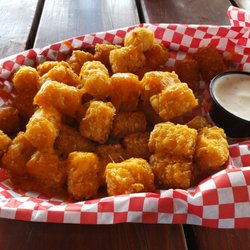 Pizza Cafe - Huge size for a side order. If you want cheesy tots, they will do either nacho cheese or melted cheddar cheese.