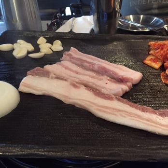 Four Plus 3 Korean BBQ - Pork belly on the Barbie with kimchi, onion and garlic - Korean Near Me - Eugene, Oregon
