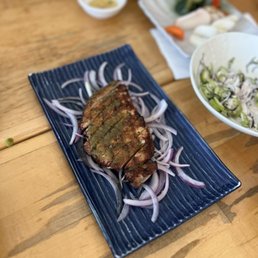 char-grilled berkshire pork with yuzu pepper paste = $18.00 char-grilled berkshire pork with yuzu pepper paste = $18.00