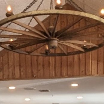 Schobels Restaurant - Wagon wheel chandelier - Buffets Near Me - Columbus, Texas Schobels Restaurant - Wagon wheel chandelier - Buffets Near Me - Columbus, Texas