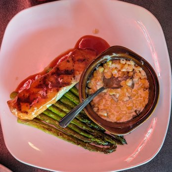 Ada Garage Bar & Grill - Grilled Atlantic Salmon with grilled asparagus and jalapeno creamed corn - Sports Bars Near Me - Ada, Michigan Ada Garage Bar & Grill - Grilled Atlantic Salmon with grilled asparagus and jalapeno creamed corn - Sports Bars Near Me - Ada, Michigan