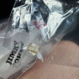 a sandwich wrapped in plastic