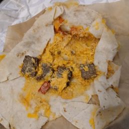 1 of the steak grilled cheese burritos, missing the tortilla chips sour cream chipotle ranch and nacho cheese and about half as much rice 1 of the steak grilled cheese burritos, missing the tortilla chips sour cream chipotle ranch and nacho cheese and about half as much rice