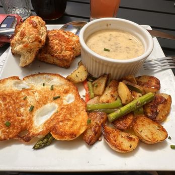 Leo & Leto's - Cheddar Biscuits and gravy with breakfast potatoes (I asked for the sausage gravy on the side). - Wine Tasting Room Near Me - Freeland, Washington