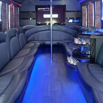 Lighthouse Limousine - 30 passenger luxury party bus - The Spectacle Reef - interior photo with floor lighting - Limos Near Me Lighthouse Limousine - 30 passenger luxury party bus - The Spectacle Reef - interior photo with floor lighting - Limos Near Me
