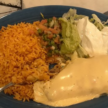 Riviera Maya - Chimichanga with rice, pico de gallo guacamole and sour cream with lettuce. - Mexican Near Me - Lafayette, Indiana Riviera Maya - Chimichanga with rice, pico de gallo guacamole and sour cream with lettuce. - Mexican Near Me - Lafayette, Indiana