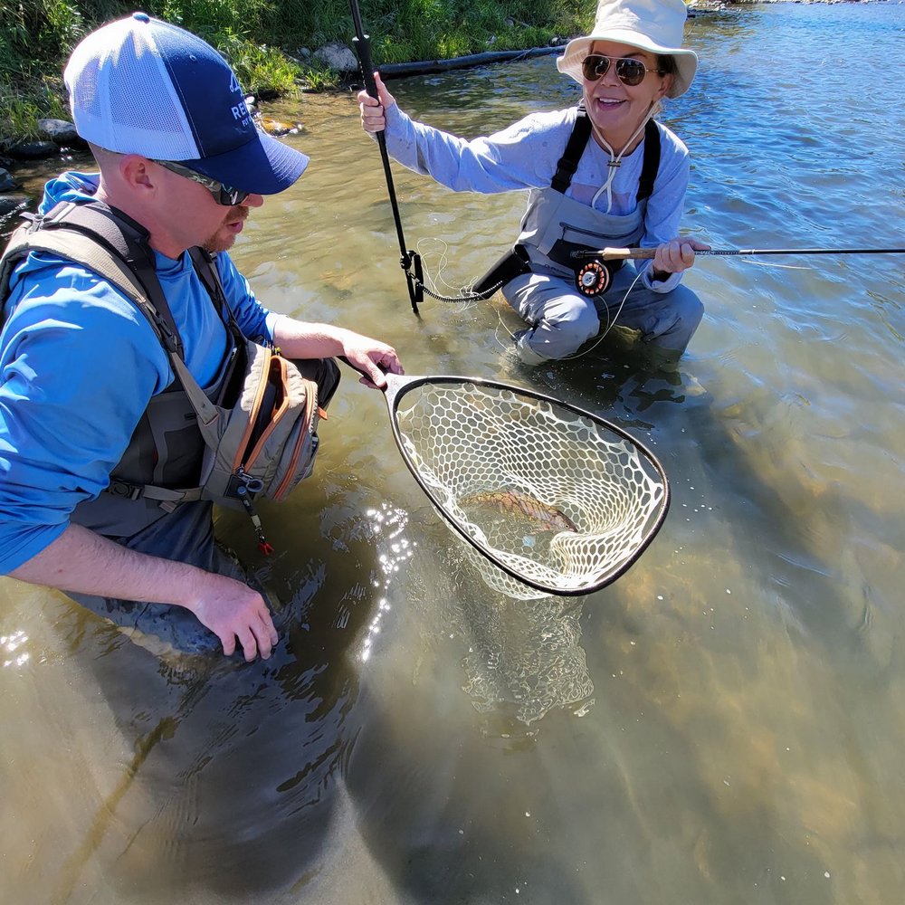 Reno Fly Shop - Jason our amazing guide helping to bring in our first catch! - Sporting Goods Near Me - Reno, Nevada