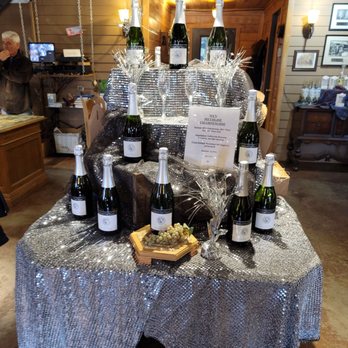 Watermelon Creek Vineyard - bottles of wine on a table - Venues & Event Spaces Near Me - Glennville, Georgia Watermelon Creek Vineyard - bottles of wine on a table - Venues & Event Spaces Near Me - Glennville, Georgia