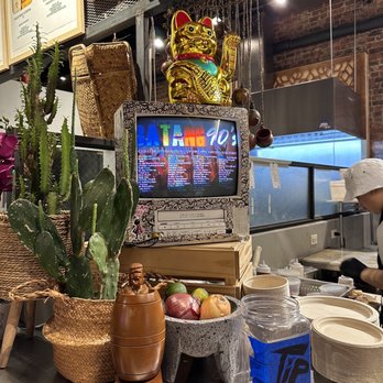 Mucho Sarap - a man working in a restaurant - Filipino Near Me - New York, New York Mucho Sarap - a man working in a restaurant - Filipino Near Me - New York, New York