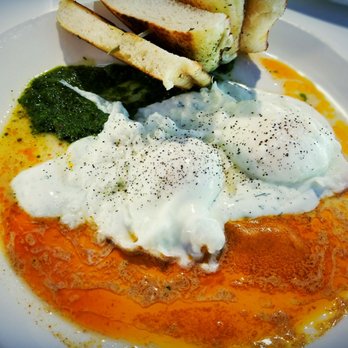 Sava's - Mediterranean Eggs (Poached Eggs with Chimichurri, Herb Yogurt, and Paprika Butter, with Toasted Focaccia) - Bars Near Me - Ann Arbor, Michigan Sava's - Mediterranean Eggs (Poached Eggs with Chimichurri, Herb Yogurt, and Paprika Butter, with Toasted Focaccia) - Bars Near Me - Ann Arbor, Michigan