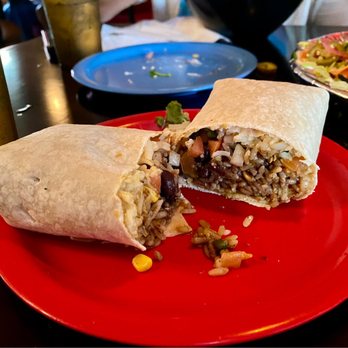 Boca Fiesta - a burrito cut in half on a red plate - Mexican Near Me - Gainesville, Florida