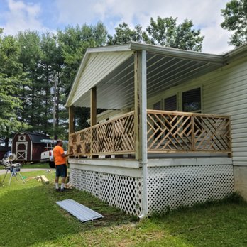 Guevara's Handy Work - a man working on a porch - Handyman Near Me - Johnson City, Tennessee