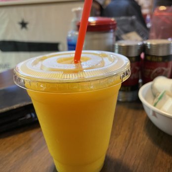 Fina's Diner - orange juice in a plastic cup - New American Near Me - Chama, New Mexico