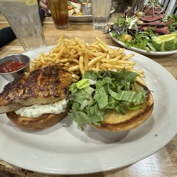Filos Tavern - This was the fish sandwich (it was a redfish) and you can also see the delicious steak salad to the right. - American Near Me - Winchester, Tennessee Filos Tavern - This was the fish sandwich (it was a redfish) and you can also see the delicious steak salad to the right. - American Near Me - Winchester, Tennessee