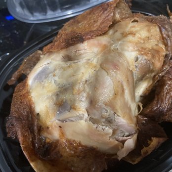 Wagshal's - a roast chicken in a plastic container - New American Near Me - Washington, DC, District of Columbia