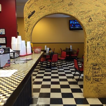 Isabella's Pizza Pub - a checkered floor and a yellow archway - Pizza Near Me - Greensboro, North Carolina Isabella's Pizza Pub - a checkered floor and a yellow archway - Pizza Near Me - Greensboro, North Carolina