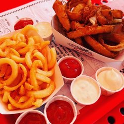 Sara's - Curly fries and onion rings - ketchup, mayonnaise, mustard and ranch available at your own service.